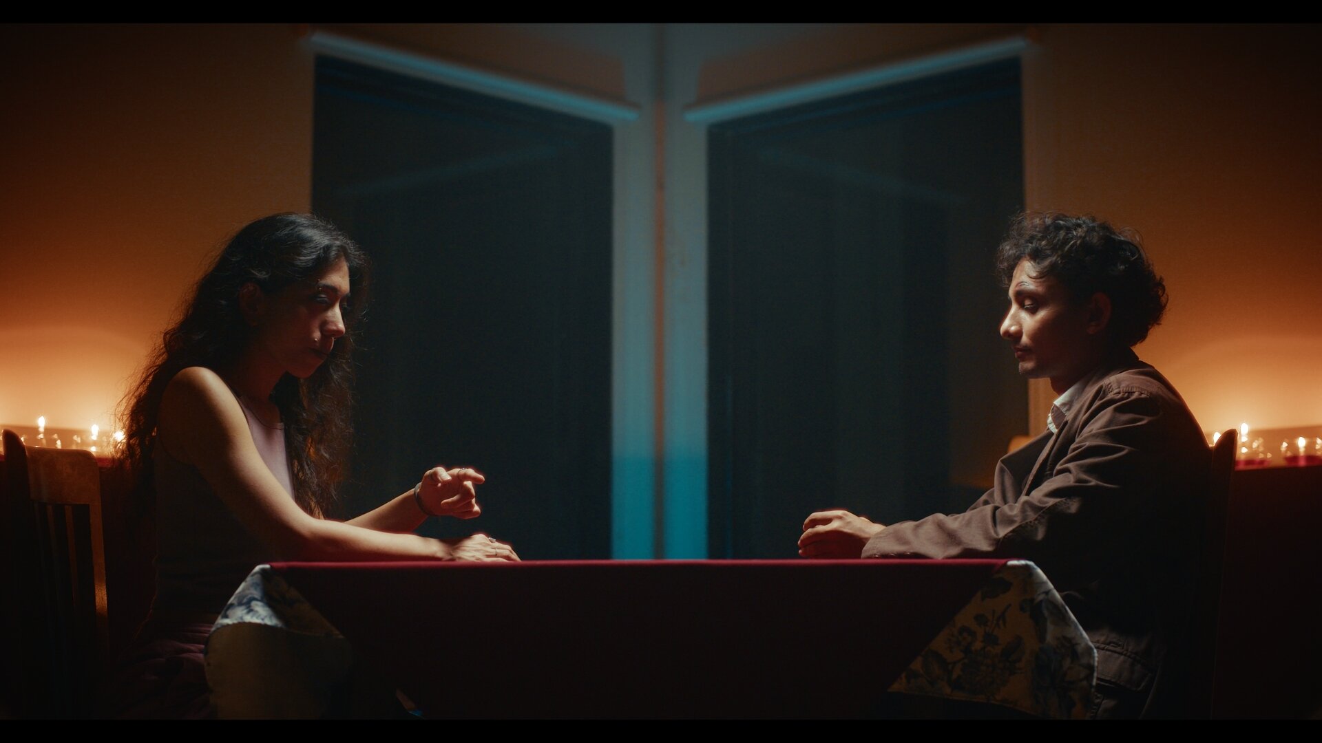 The Sneeze — candlelit table still